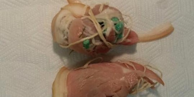 The bacon-wrapped poison that was thrown over an Auckland resident's fence. Photo / Facebook